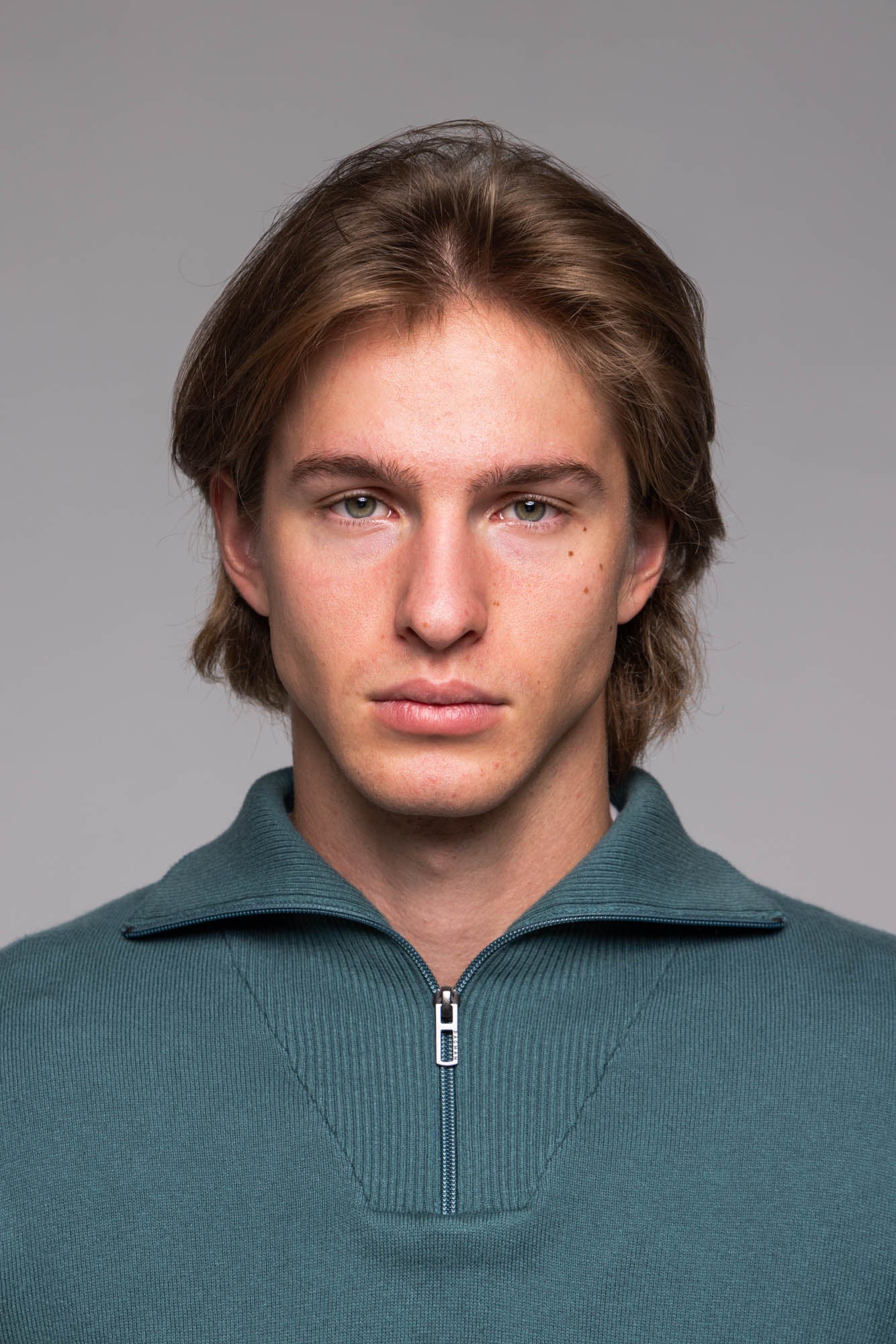 Green zip-up sweater